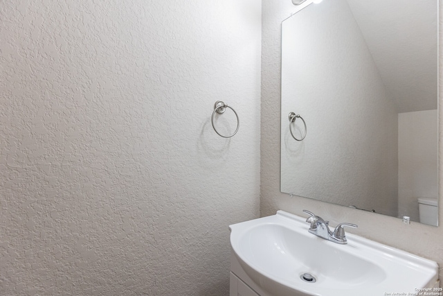 bathroom with toilet and sink