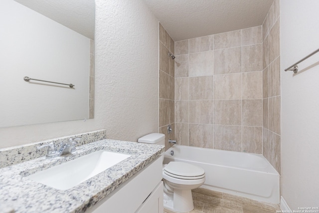 full bathroom with a textured ceiling, toilet, vanity, and  shower combination