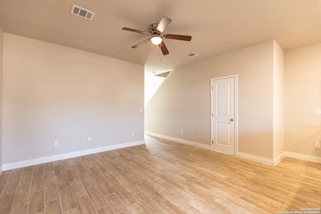 unfurnished room with ceiling fan and light hardwood / wood-style floors