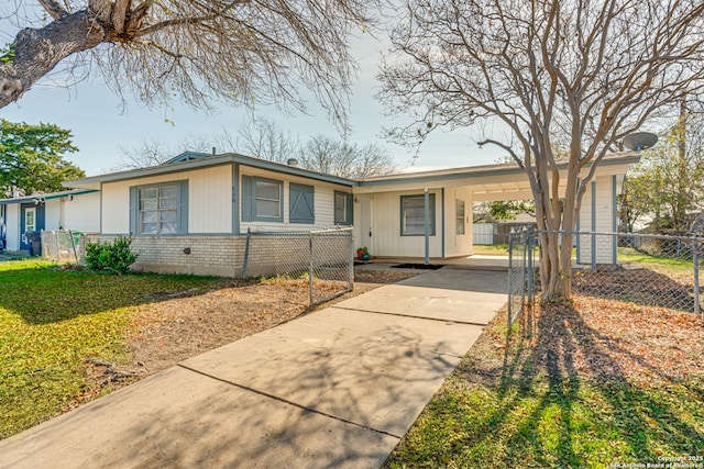 ranch-style home featuring a carport