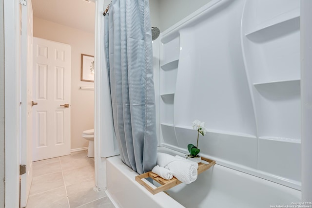 bathroom featuring toilet, shower / tub combo with curtain, and tile patterned flooring