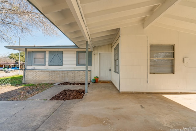 property entrance featuring a patio area