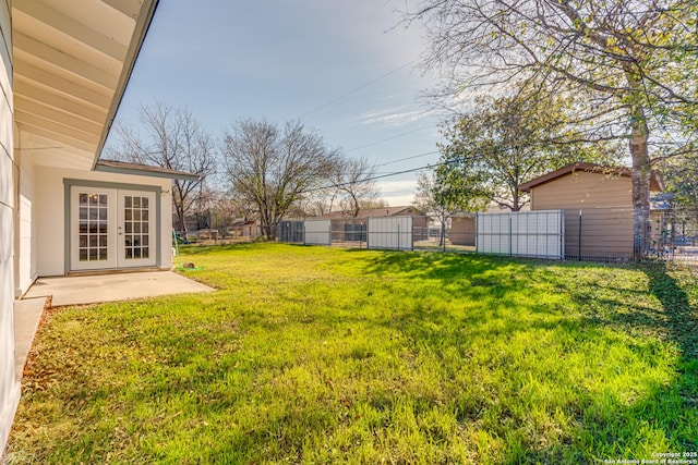 view of yard featuring french doors and a patio