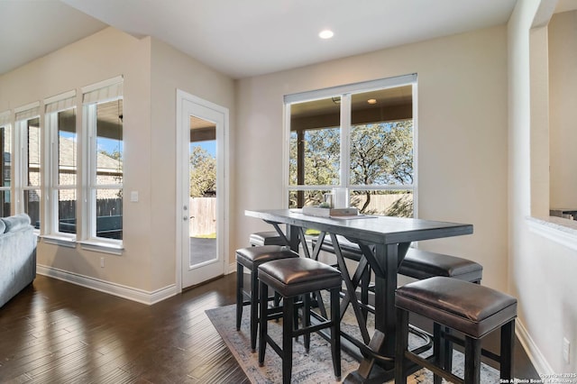 dining area with dark wood-type flooring