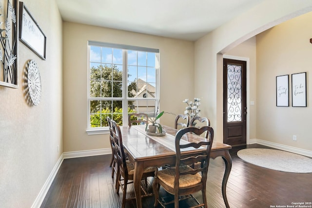 dining area featuring dark hardwood / wood-style floors