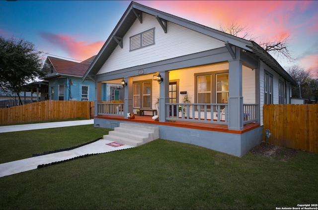 exterior space with a porch and a yard