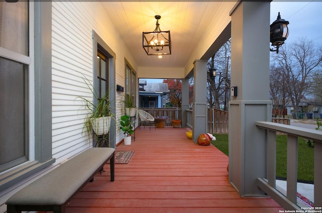 wooden terrace featuring covered porch