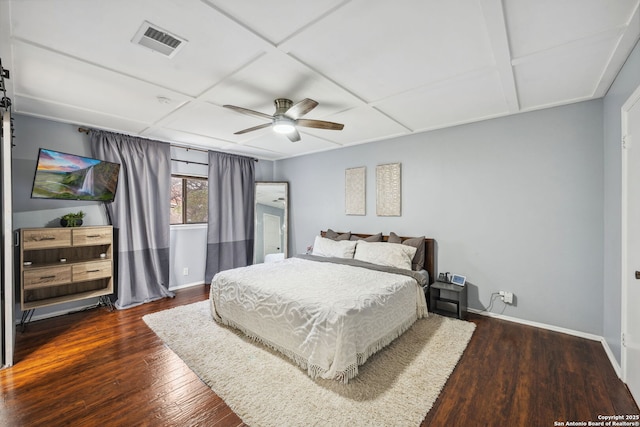 bedroom with ceiling fan, dark hardwood / wood-style floors, and coffered ceiling