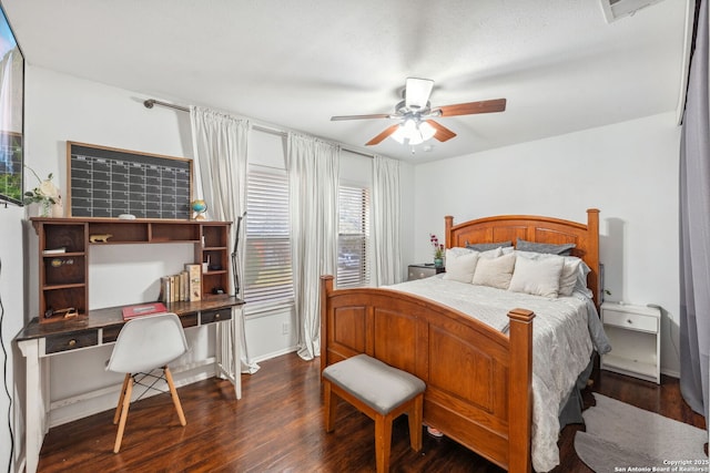 bedroom with ceiling fan and dark hardwood / wood-style flooring