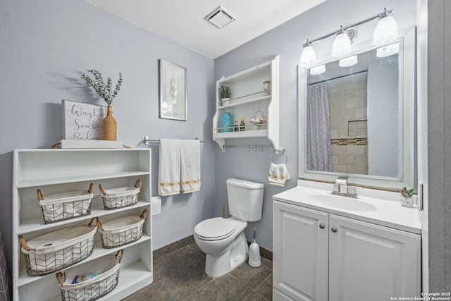 bathroom featuring toilet, tile patterned floors, a shower with curtain, and vanity