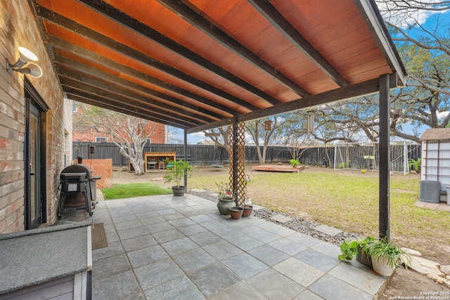 view of patio featuring a grill