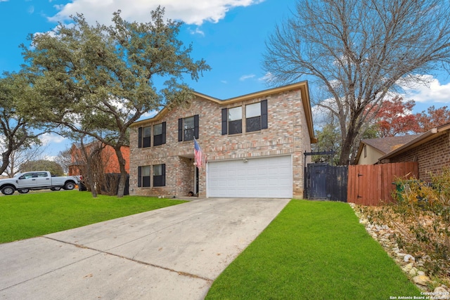 view of property featuring a garage and a front yard