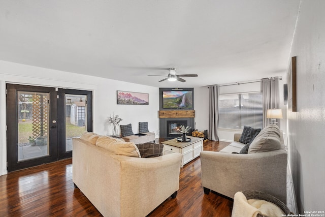 living room featuring dark wood-type flooring, french doors, and ceiling fan