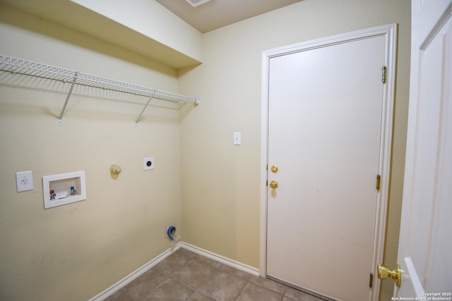 clothes washing area with light tile patterned floors, gas dryer hookup, hookup for a washing machine, and hookup for an electric dryer