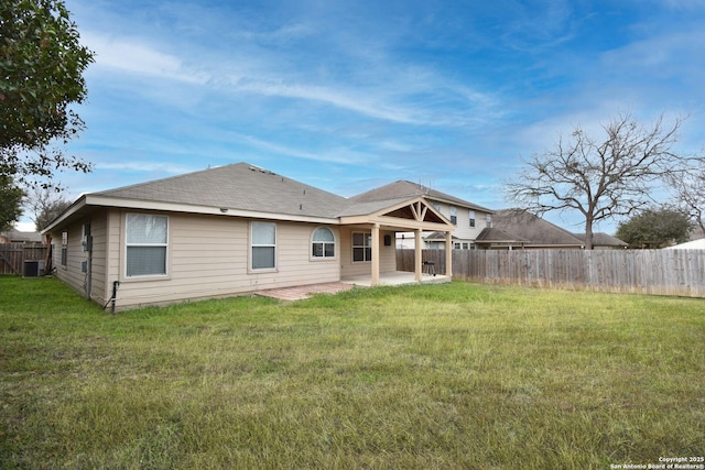 back of house featuring a patio area, central air condition unit, and a lawn