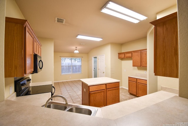 kitchen featuring light tile patterned flooring, kitchen peninsula, electric range, and sink