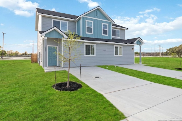 back of house featuring a lawn