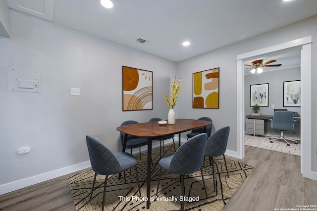 dining area featuring ceiling fan and light hardwood / wood-style floors