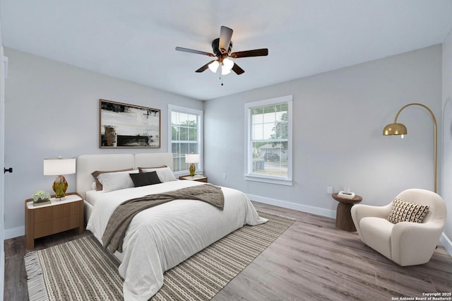 bedroom featuring ceiling fan and light hardwood / wood-style floors