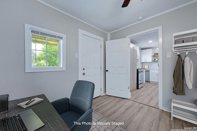 home office featuring ceiling fan, ornamental molding, and light hardwood / wood-style flooring