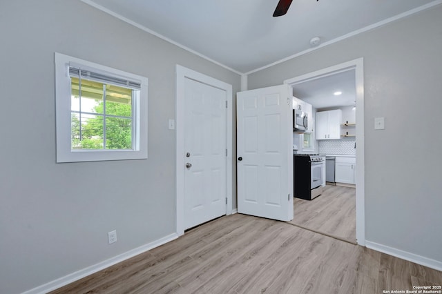 spare room featuring ceiling fan and light hardwood / wood-style floors