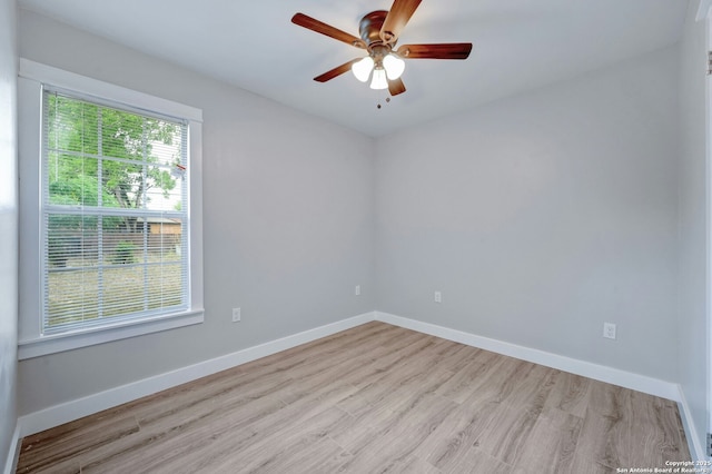 spare room with ceiling fan and light hardwood / wood-style floors