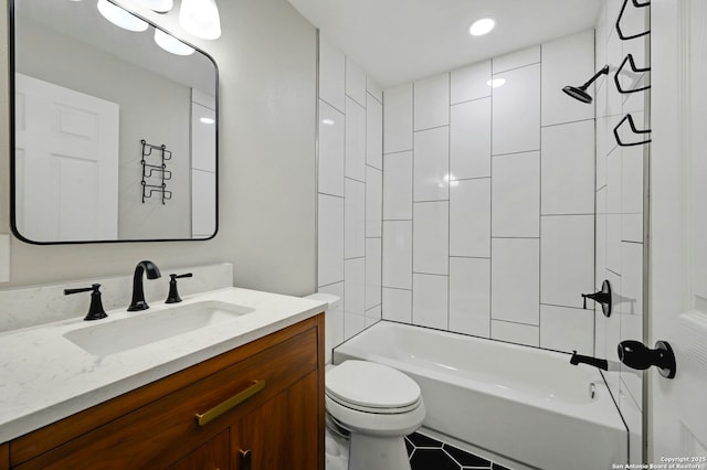 full bathroom with toilet, vanity, tile patterned floors, and tiled shower / bath