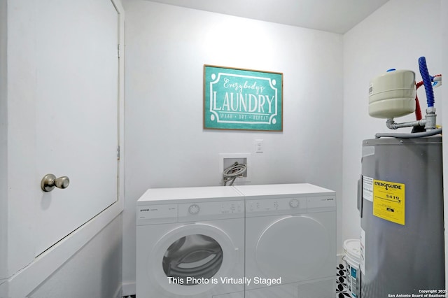 laundry area featuring washer and dryer and electric water heater