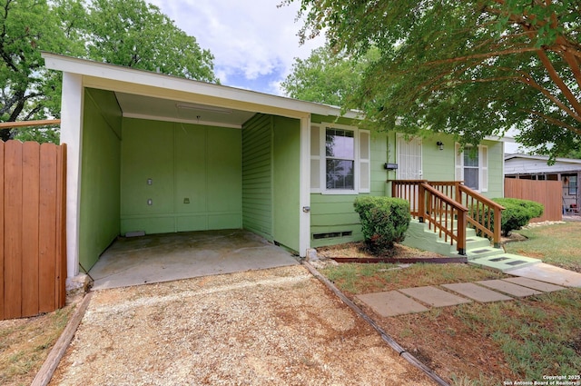 ranch-style house with a carport