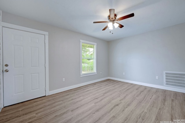 unfurnished room featuring ceiling fan and light hardwood / wood-style floors