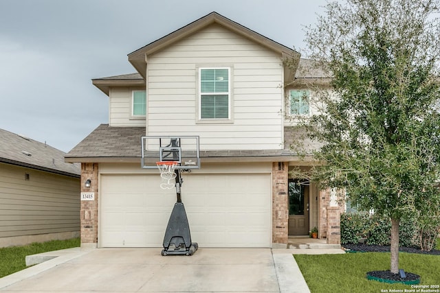 view of front of house featuring a garage and a front lawn