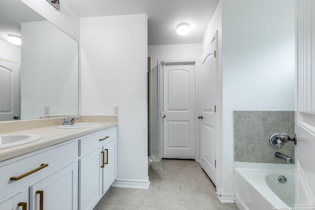 bathroom featuring a bath and vanity