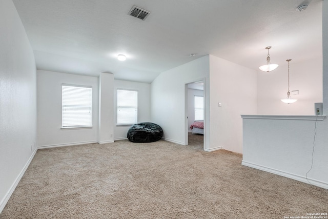 unfurnished room with light colored carpet