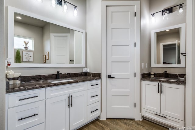 bathroom featuring hardwood / wood-style floors and vanity