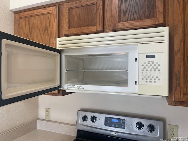 interior details with stainless steel electric range oven