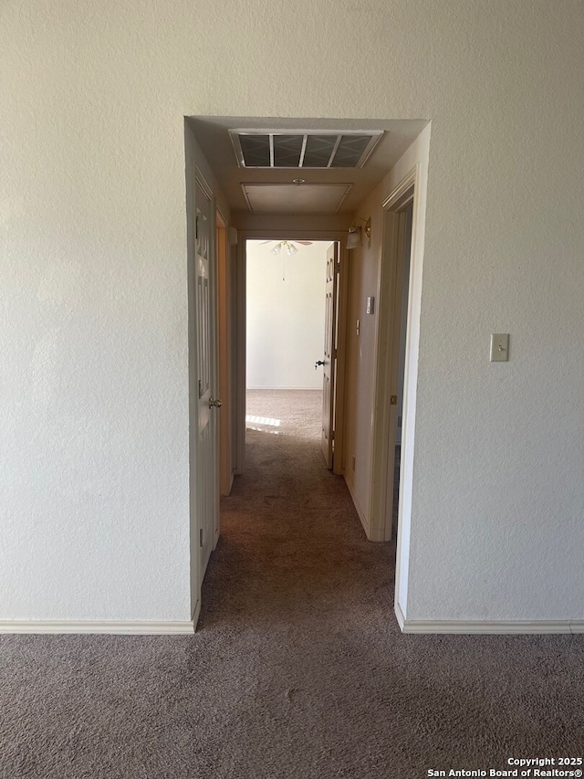 hallway with dark carpet