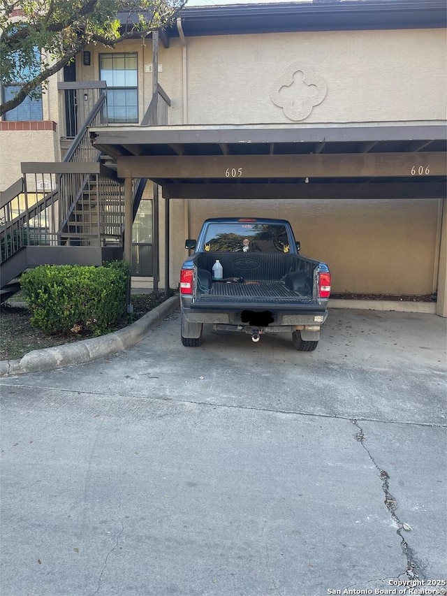 exterior space with a carport