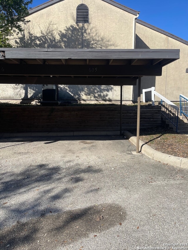 view of vehicle parking featuring a carport