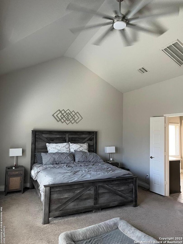 carpeted bedroom featuring vaulted ceiling and ceiling fan