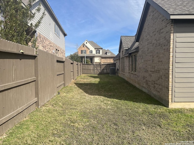 view of yard featuring central AC unit