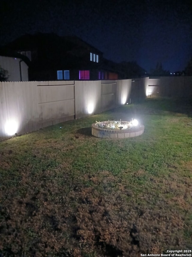 view of yard at night