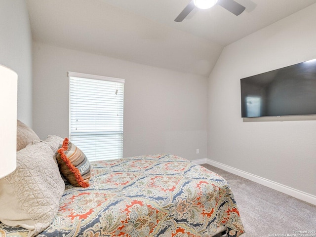 carpeted bedroom featuring vaulted ceiling and ceiling fan