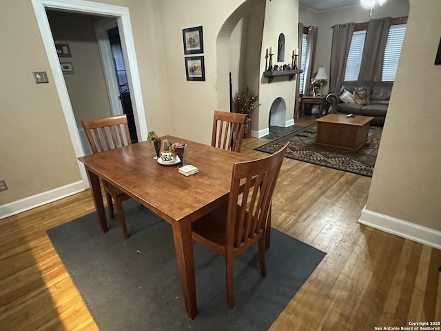 dining area with dark hardwood / wood-style flooring