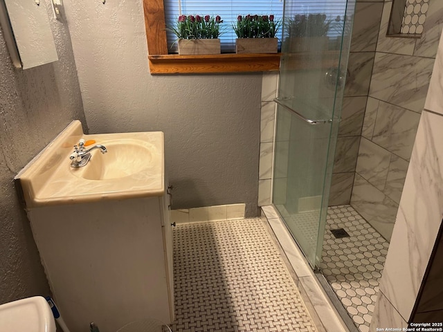 bathroom with vanity and an enclosed shower