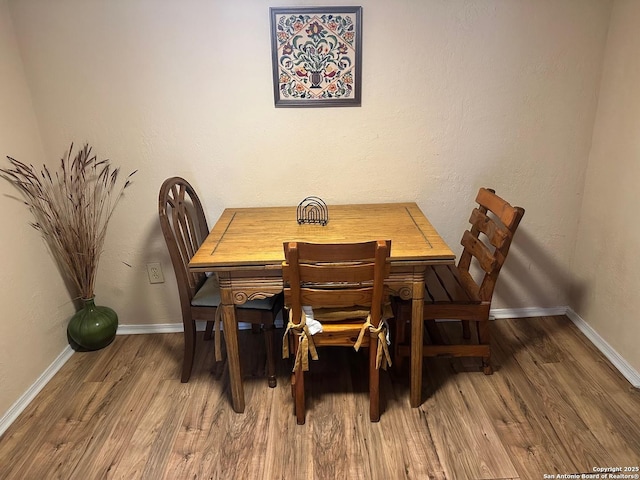 dining space featuring hardwood / wood-style floors