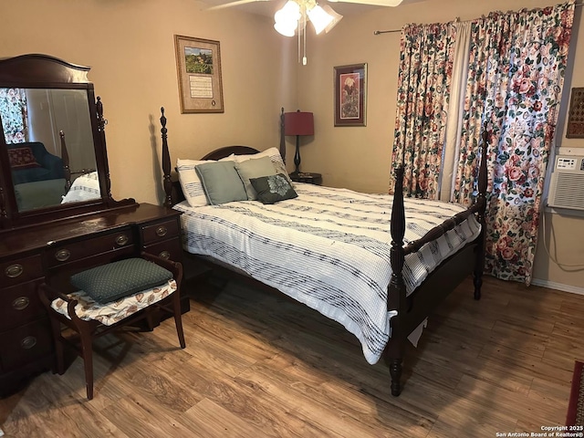 bedroom featuring ceiling fan and wood-type flooring