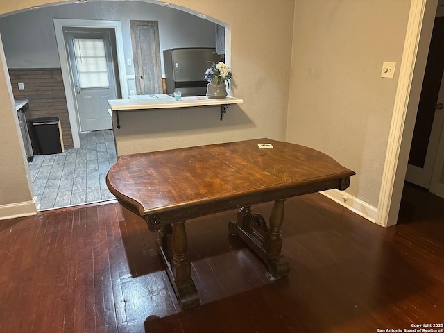 miscellaneous room with dark hardwood / wood-style flooring and a fireplace