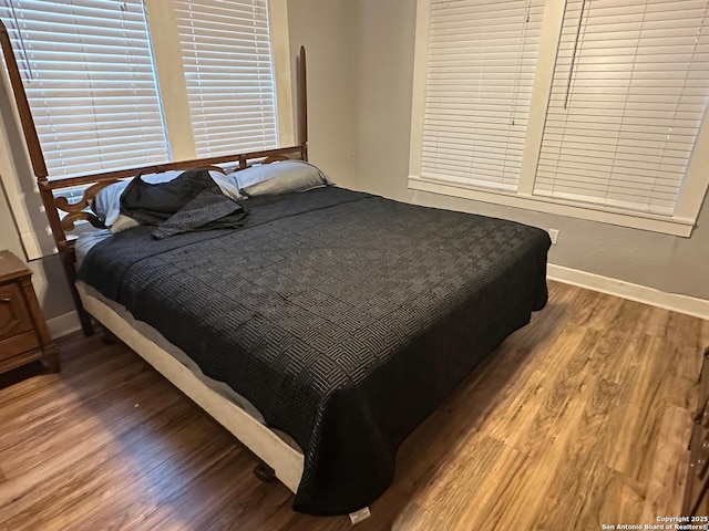 bedroom with hardwood / wood-style floors