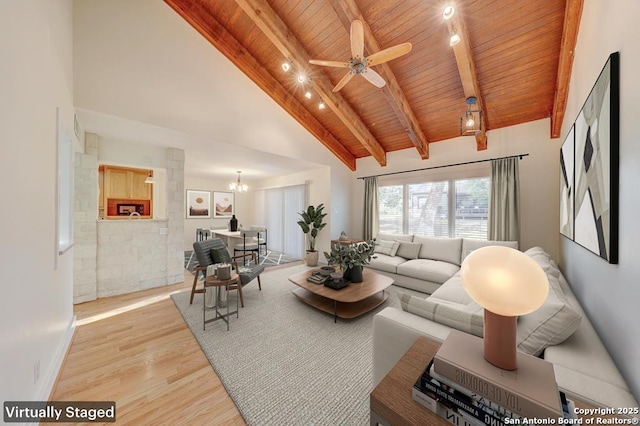 living room featuring light hardwood / wood-style floors, beam ceiling, wood ceiling, high vaulted ceiling, and ceiling fan with notable chandelier