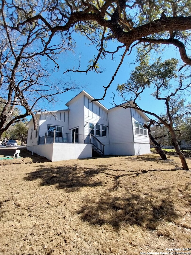1064 Overbrook Ln, Spring Branch, TX 78070 - rear view of house featuring board and batten siding